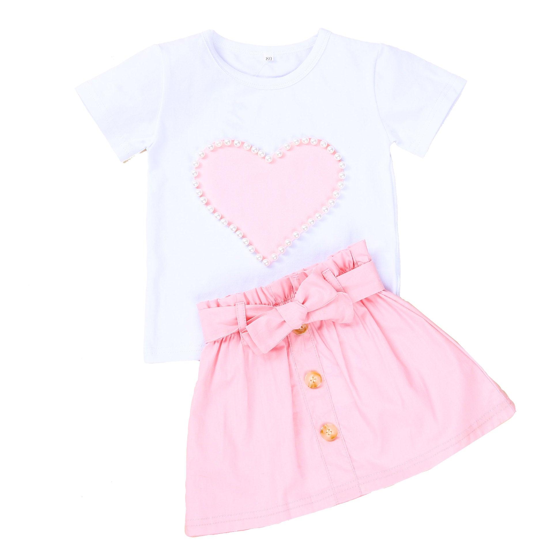 Elegance in Bloom: New Girl Pearl Love White Short Sleeve + Bow Skirt Set